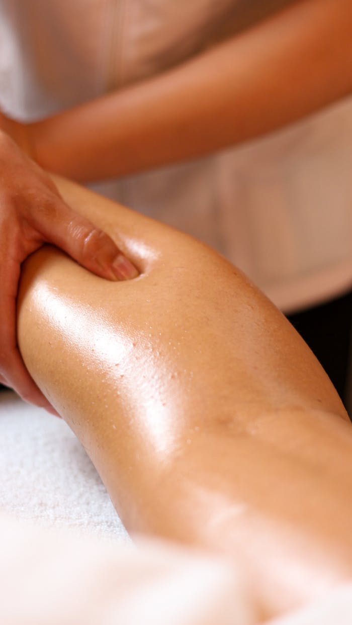 Close-up of a relaxing leg massage in a spa, highlighting wellness and relaxation.